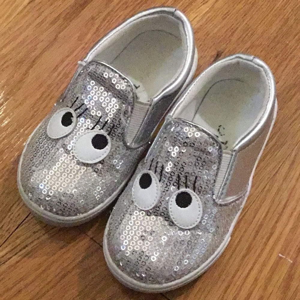 Brash silver shoes with eyes